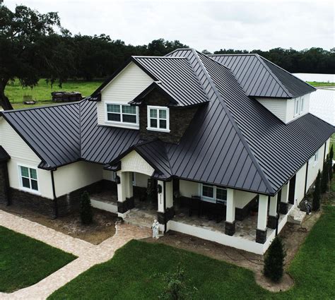 black metal roof with hemlock house|are black metal roofs good.